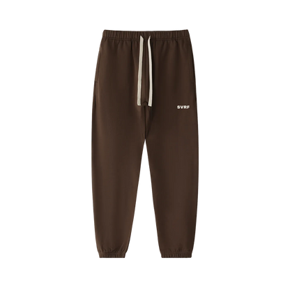 Coffee brown SVRF Core Sweatpants, front, showing the drawcord waist and the SVRF logo on the right thigh