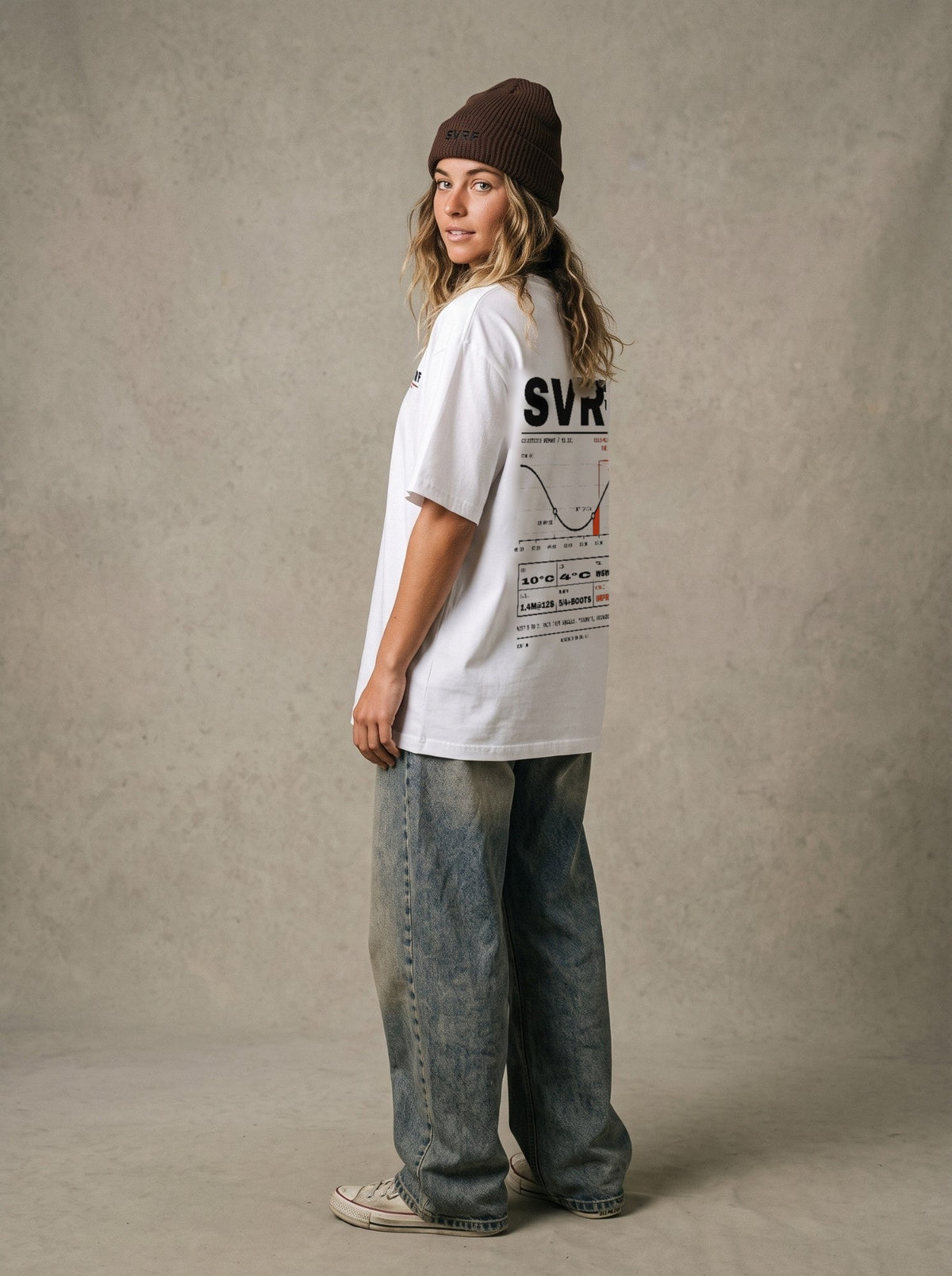 SVRF Forecast Tee in white, styled with a brown beanie and wide jeans, back three-quarter view