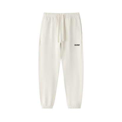 SVRF Core Sweatpants in Chalk, heavyweight cream cotton sweatpants with drawcord waist and cuffed ankles, shown from the front