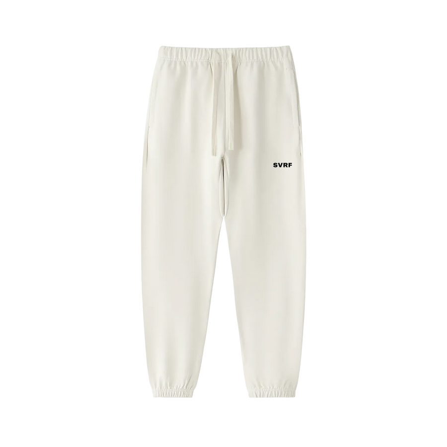 SVRF Core Sweatpants in Chalk, heavyweight cream cotton sweatpants with drawcord waist and cuffed ankles, shown from the front