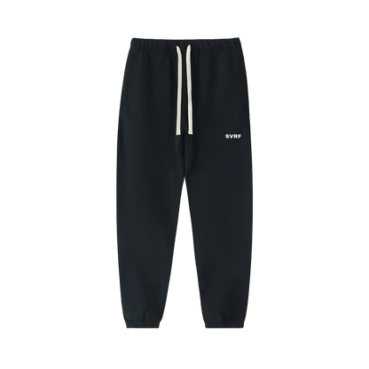 Black SVRF Core Sweatpants, front, showing the drawcord waist and the SVRF logo on the right thigh